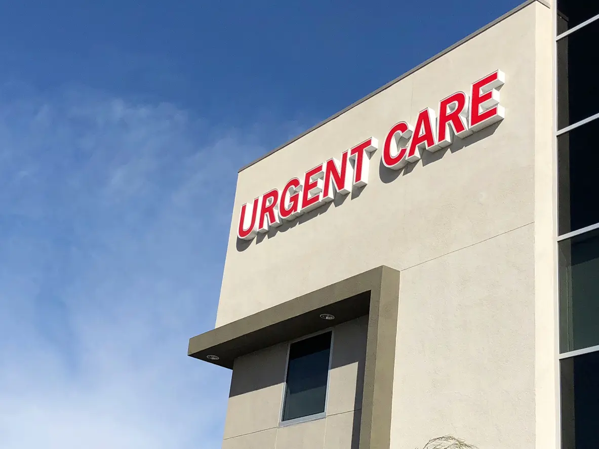 A large building with the words urgent care on it.