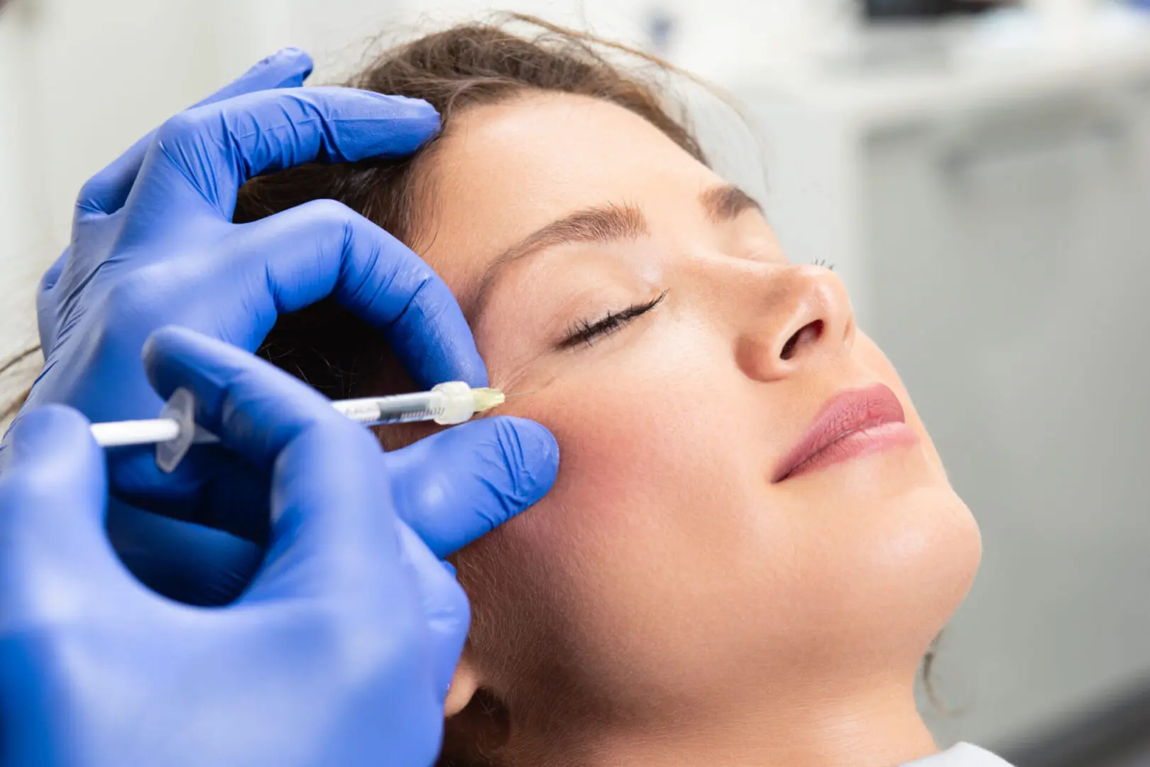 Attractive,Young,Woman,Is,Getting,A,Rejuvenating,Facial, Injectables and Fillers .